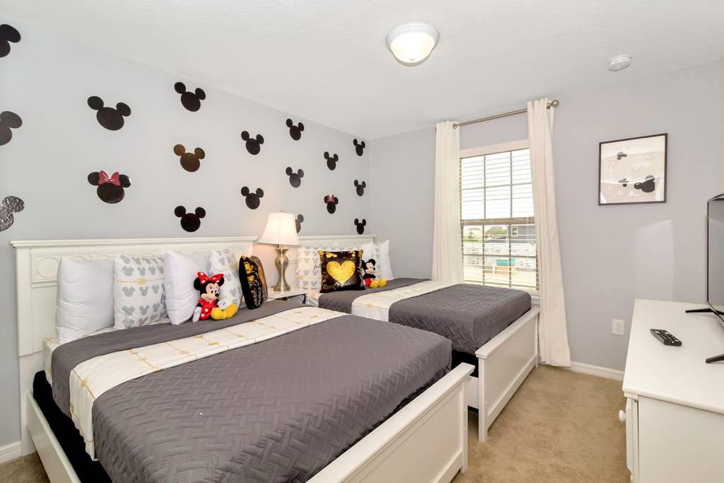 https://myvillakey.com/wp-content/uploads/2020/12/Themed-Mickey-Mouse-Bedroom-Disney-Vacation-Rental.jpg